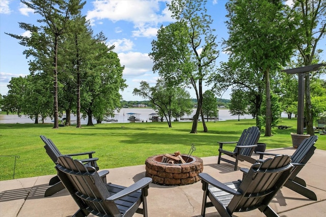 view of patio featuring a water view and an outdoor fire pit