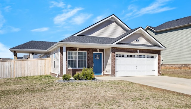 view of front of home with a garage, driveway, a shingled roof, a front lawn, and brick siding