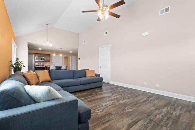 living room featuring high vaulted ceiling, dark wood finished floors, visible vents, and baseboards