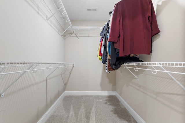 spacious closet with carpet and visible vents