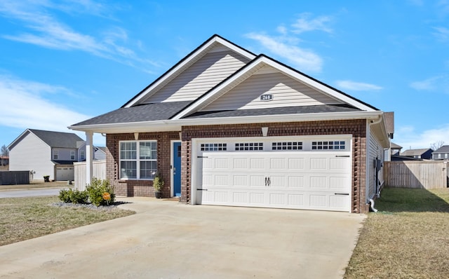 view of front of house with a garage, driveway, roof with shingles, fence, and brick siding