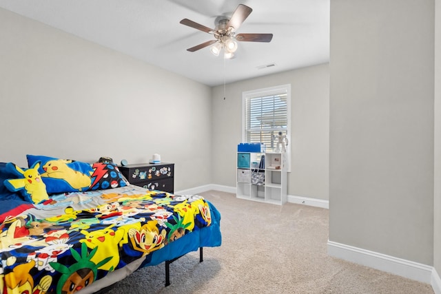 carpeted bedroom featuring visible vents, baseboards, and a ceiling fan