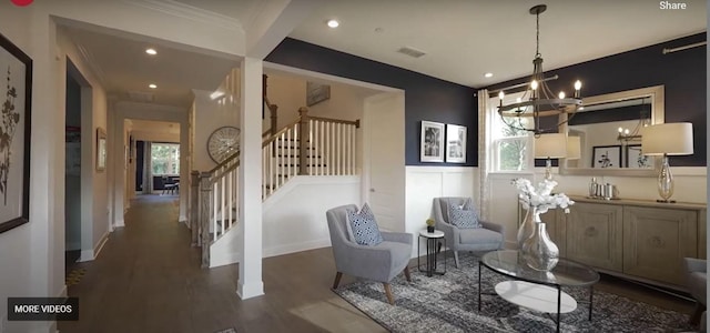 living area featuring recessed lighting, wood finished floors, stairs, an inviting chandelier, and crown molding