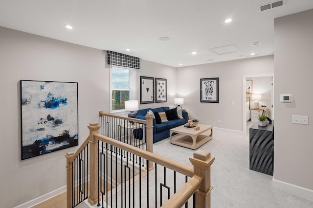 living room featuring attic access, recessed lighting, visible vents, and baseboards