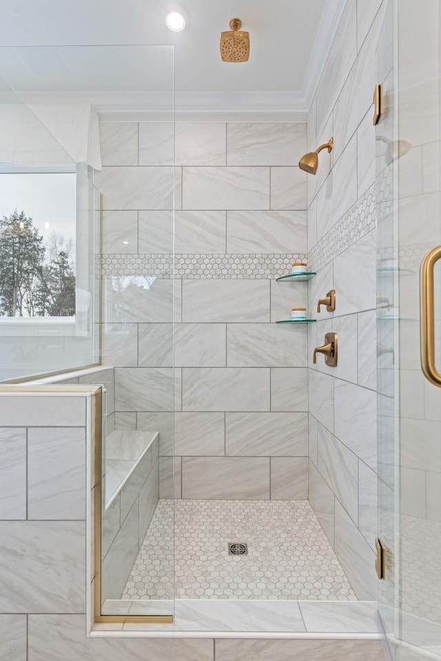 full bathroom with ornamental molding and a stall shower