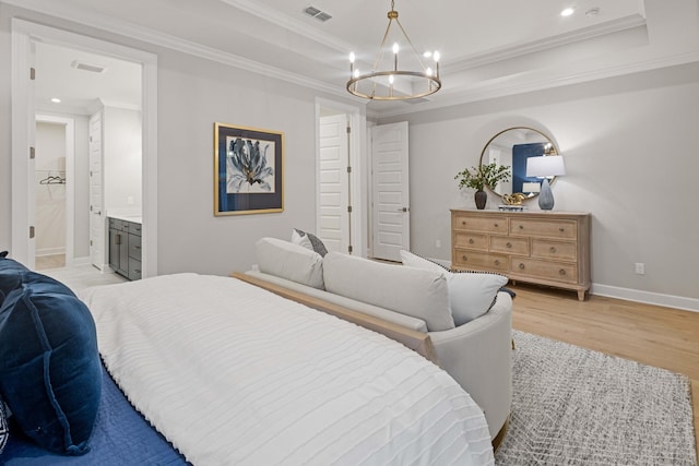 bedroom featuring ornamental molding, a raised ceiling, visible vents, and light wood-style floors