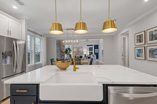 kitchen with white cabinetry, visible vents, appliances with stainless steel finishes, light stone countertops, and crown molding