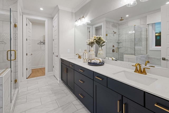 full bath with marble finish floor, double vanity, ornamental molding, a sink, and a shower stall