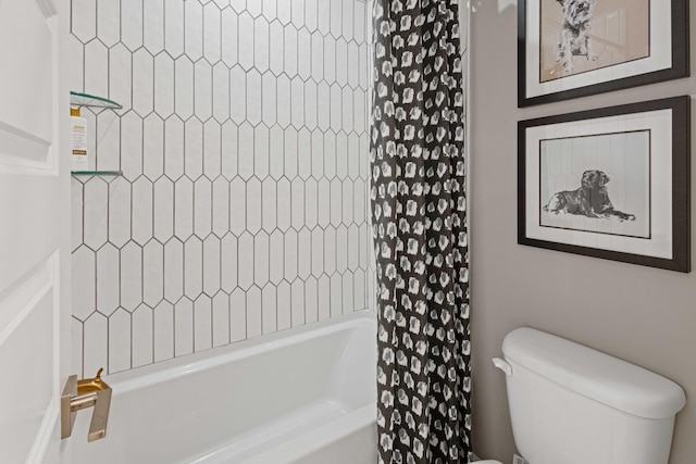 bathroom with shower / tub combo and toilet