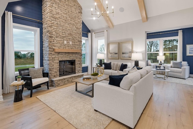 living area featuring high vaulted ceiling, wood finished floors, and beamed ceiling