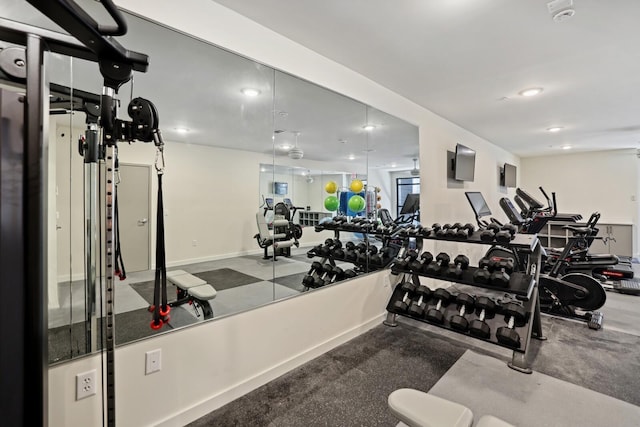 gym featuring baseboards and recessed lighting