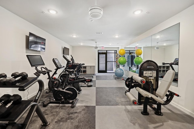 workout area featuring baseboards, visible vents, and recessed lighting