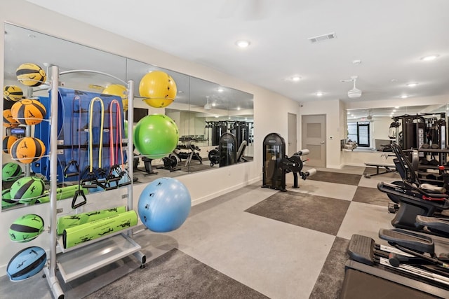 exercise room with recessed lighting, visible vents, and baseboards