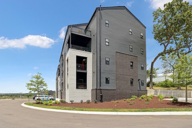 view of property exterior featuring brick siding