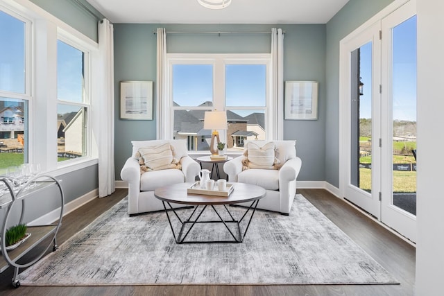 interior space featuring plenty of natural light, wood finished floors, and baseboards