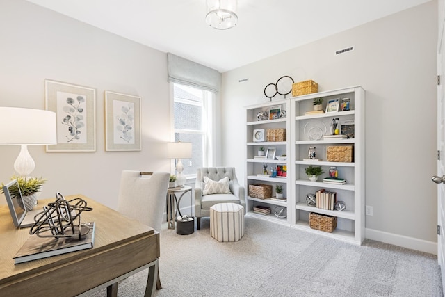 sitting room featuring carpet floors, visible vents, and baseboards