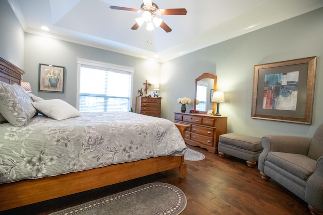 bedroom with wood finished floors, a raised ceiling, a ceiling fan, and recessed lighting