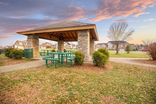 view of property's community with a yard and a gazebo