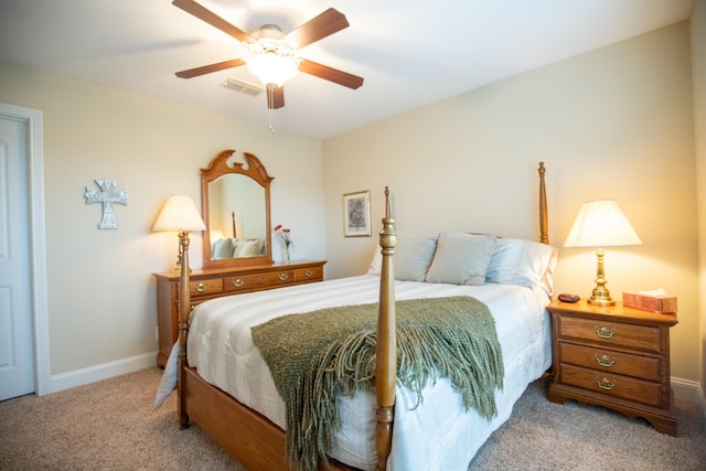 bedroom featuring light carpet, visible vents, a ceiling fan, and baseboards