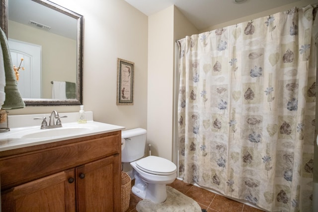 bathroom featuring tile patterned flooring, toilet, a shower with shower curtain, vanity, and visible vents