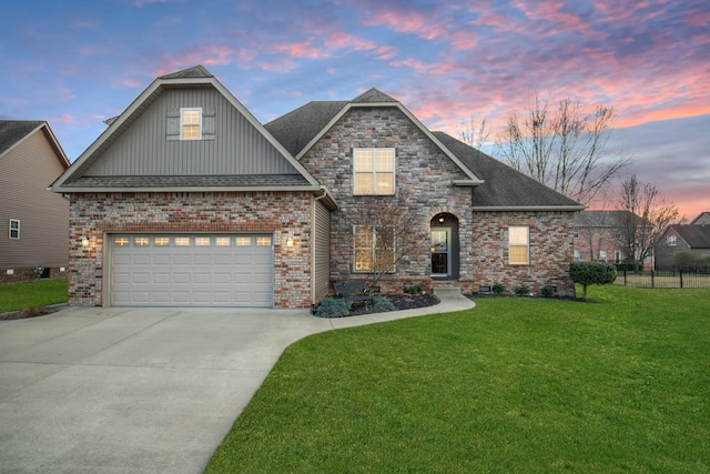 view of front of property featuring concrete driveway, roof with shingles, fence, a front yard, and brick siding