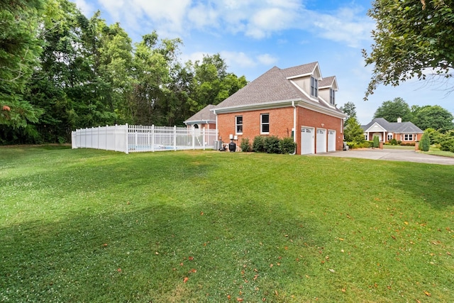 view of property exterior with a garage, a yard, brick siding, and fence