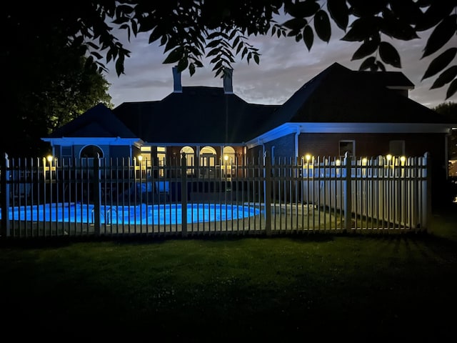 view of swimming pool with fence and a fenced in pool