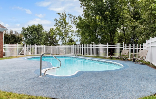 view of pool featuring fence, a fenced in pool, and a patio