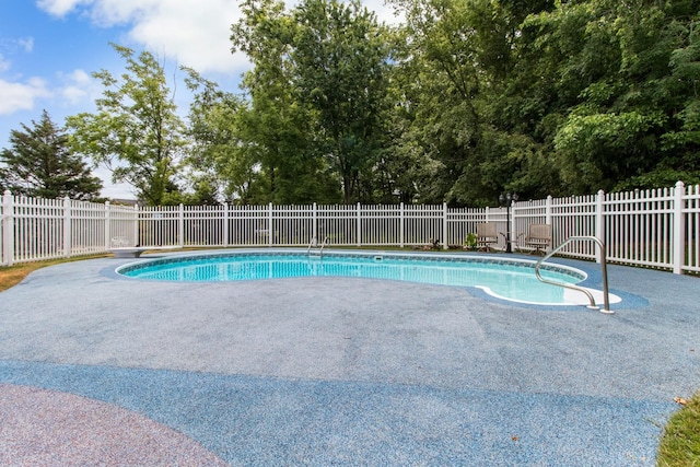 view of pool with fence, a fenced in pool, and a patio