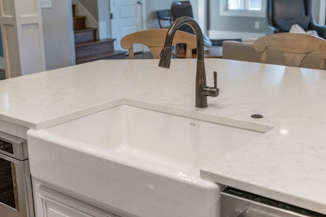 interior details with a sink and stainless steel oven