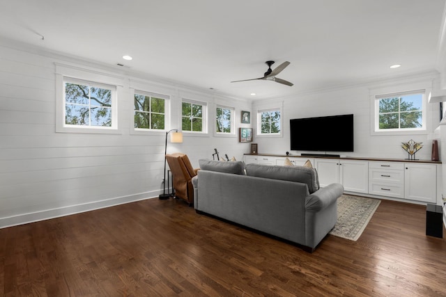 living room featuring dark wood-style floors, recessed lighting, and ornamental molding