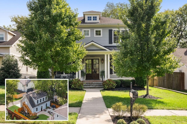 american foursquare style home with covered porch, fence, a front lawn, and french doors