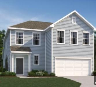 view of front of home with an attached garage, concrete driveway, and a front yard