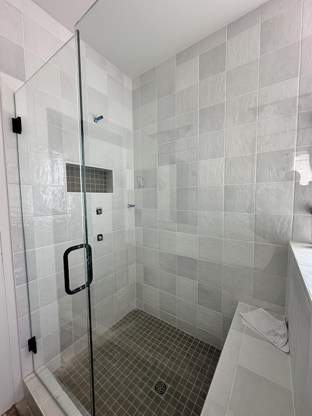 bathroom with a shower stall