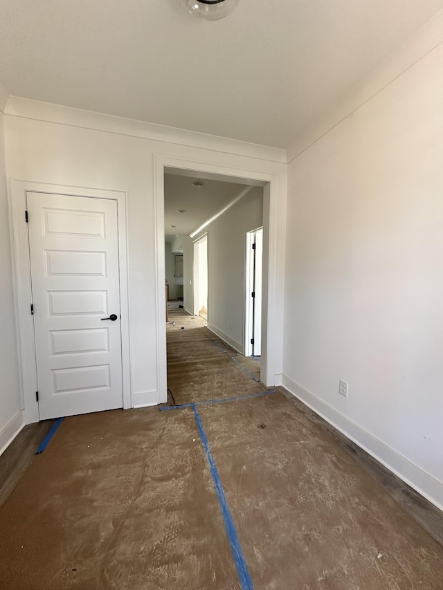 interior space featuring baseboards