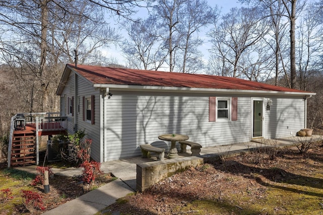 exterior space featuring a deck and stairs