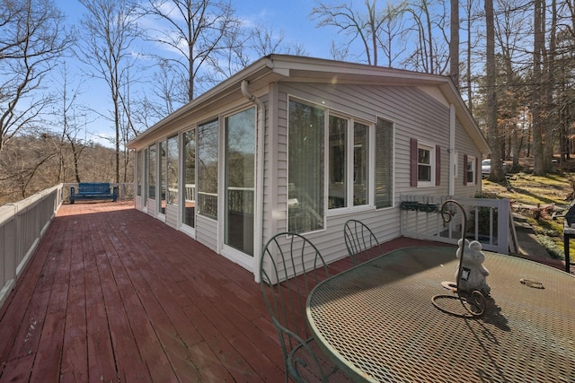 wooden terrace with a sunroom