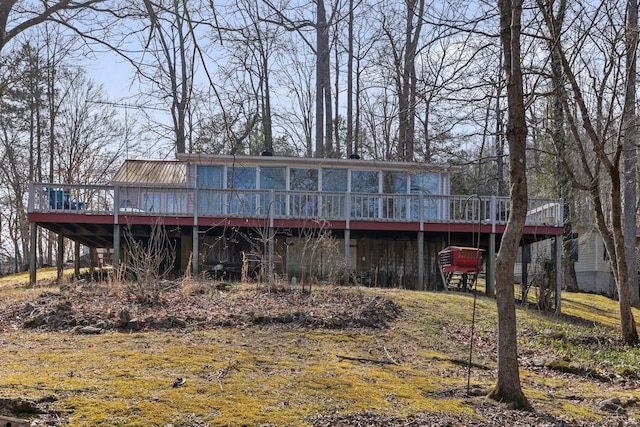 back of house featuring a wooden deck