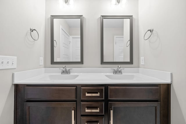 bathroom with a sink and double vanity