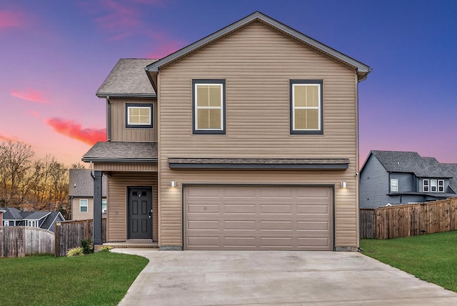 traditional-style home featuring a garage, a front lawn, board and batten siding, and fence