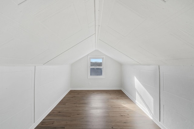 bonus room featuring lofted ceiling and wood finished floors