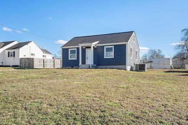 bungalow-style home featuring crawl space, a front yard, fence, and central air condition unit