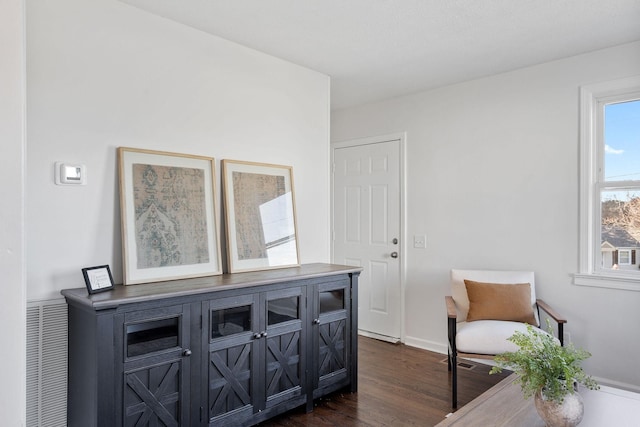 sitting room featuring dark wood-style floors and baseboards