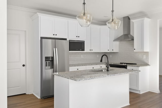 kitchen with stainless steel appliances, a sink, white cabinetry, wall chimney range hood, and crown molding