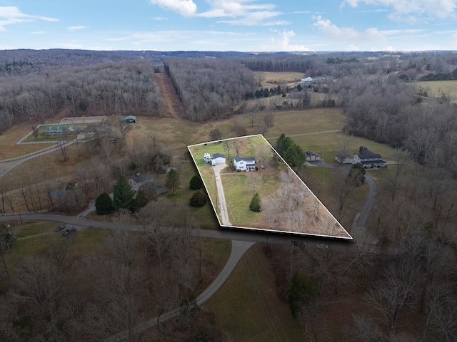 drone / aerial view with a forest view and a rural view