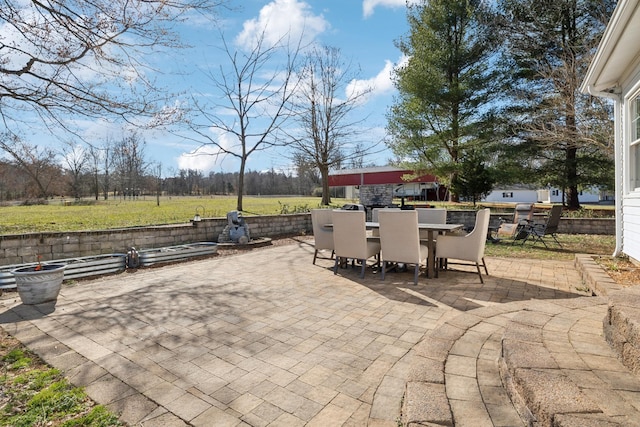 view of patio featuring outdoor dining area