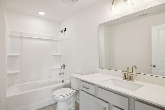 bathroom with toilet, vanity, visible vents, and shower / bathing tub combination