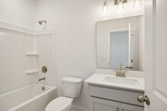 bathroom with shower / washtub combination, vanity, and toilet