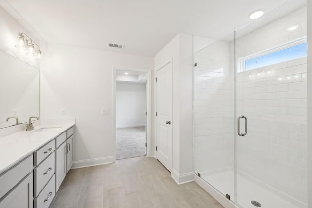 bathroom featuring recessed lighting, visible vents, a stall shower, vanity, and baseboards