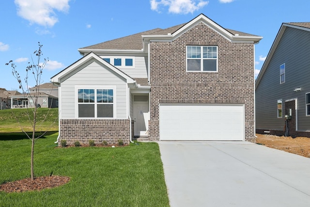 traditional-style house featuring a garage, a front yard, concrete driveway, and brick siding